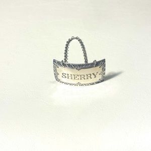 Stieff sterling silver liquor decanter label.